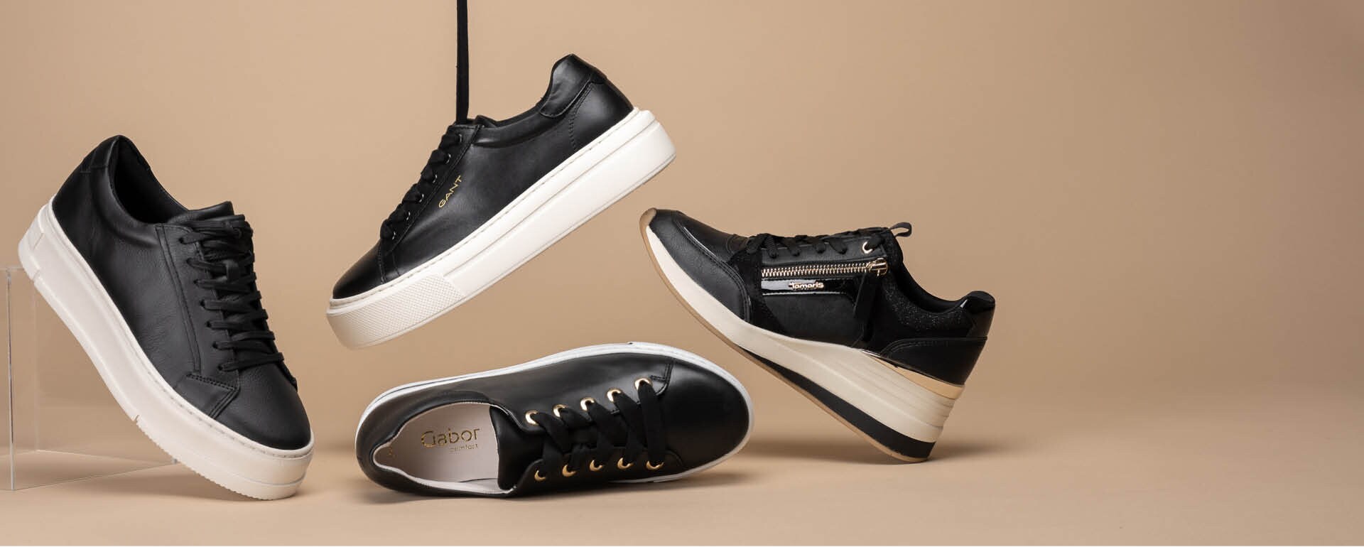 https://www.skoman.se/pub_docs/files/Skoman2023/Startsida-Slider-DESKTOP-Svarta-sneakers-SS23-2.jpg
