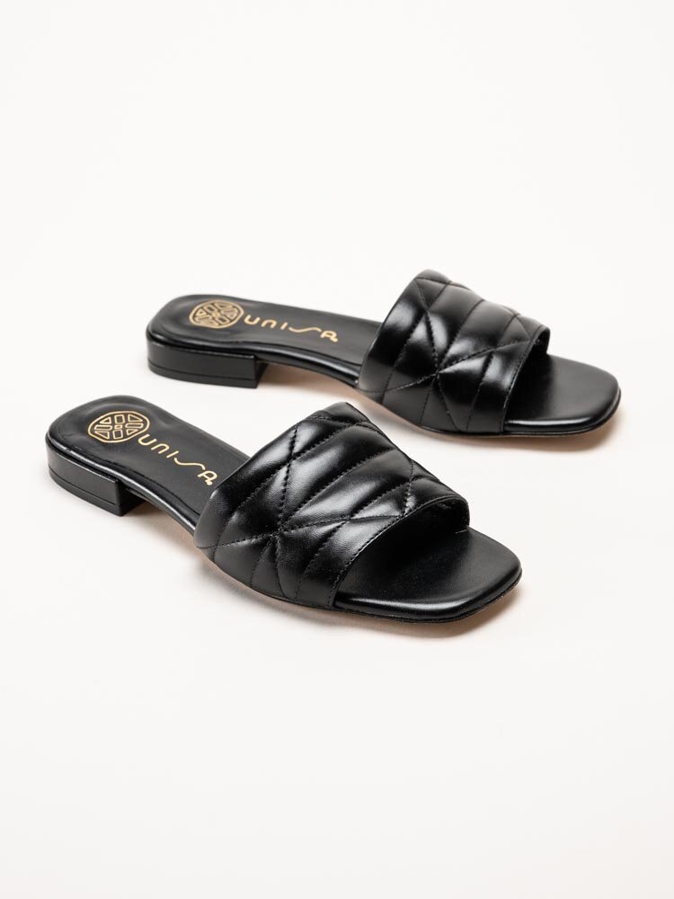 Unisa - Cruset - Svarta slip-in sandaler i skinn