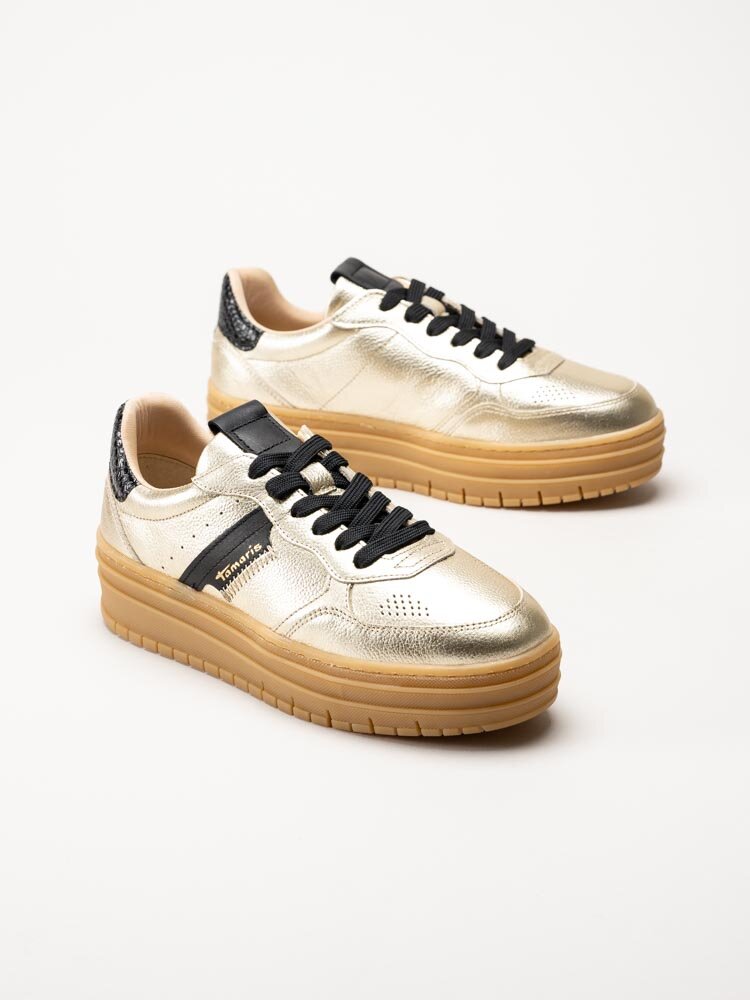 Tamaris - Guldfärgade platåsneakers i skinn
