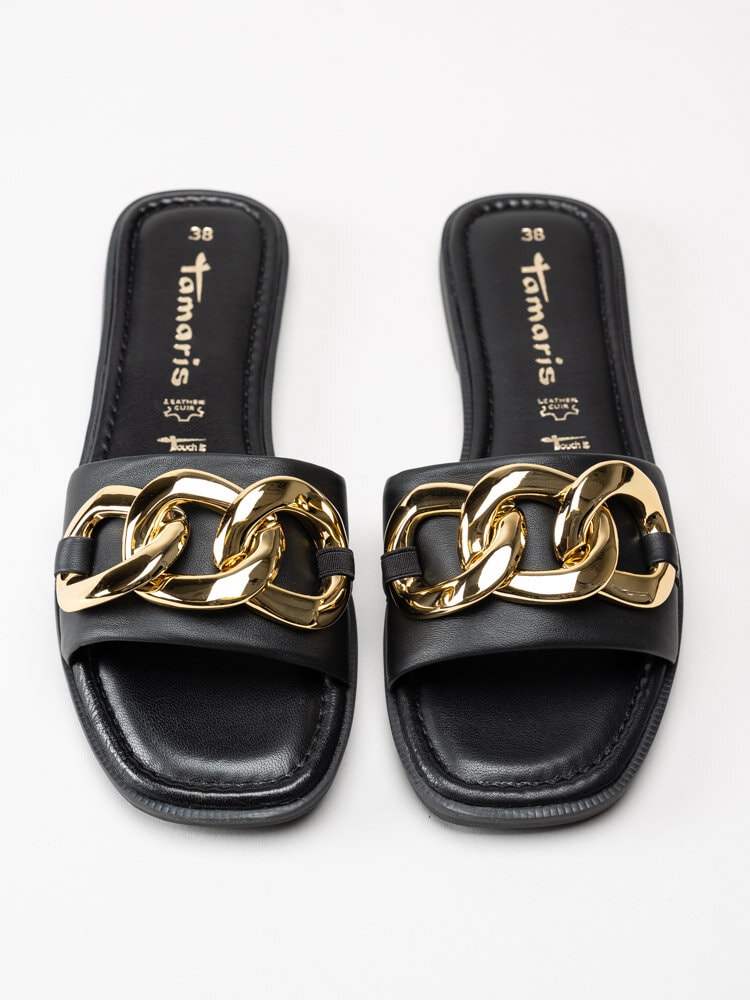 Tamaris - Svarta slip in sandaler med guldfärgad dekor