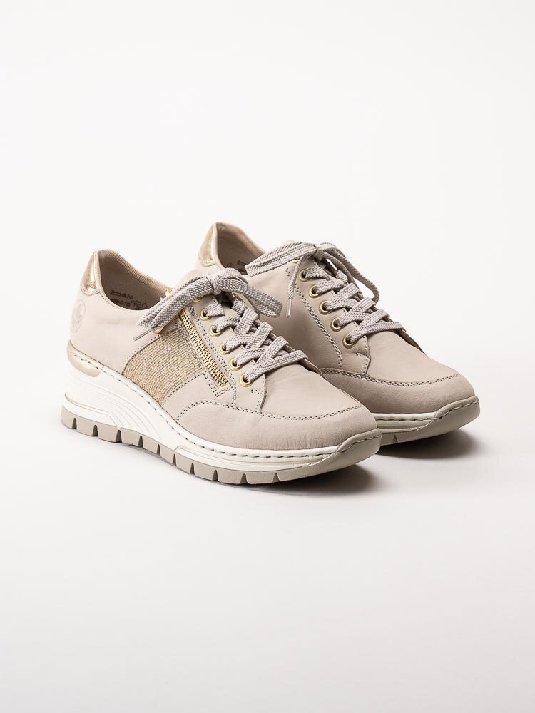 Rieker - Beige kilklackade sneakers med gulddetaljer