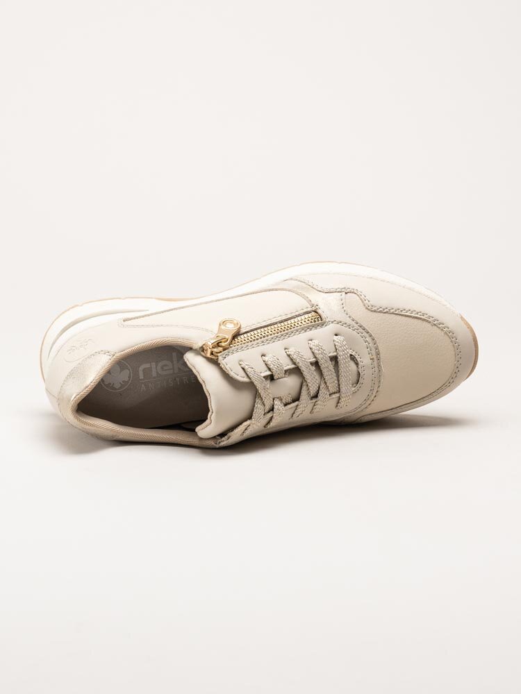 Rieker - Beige kilklackade sneakers i skinn