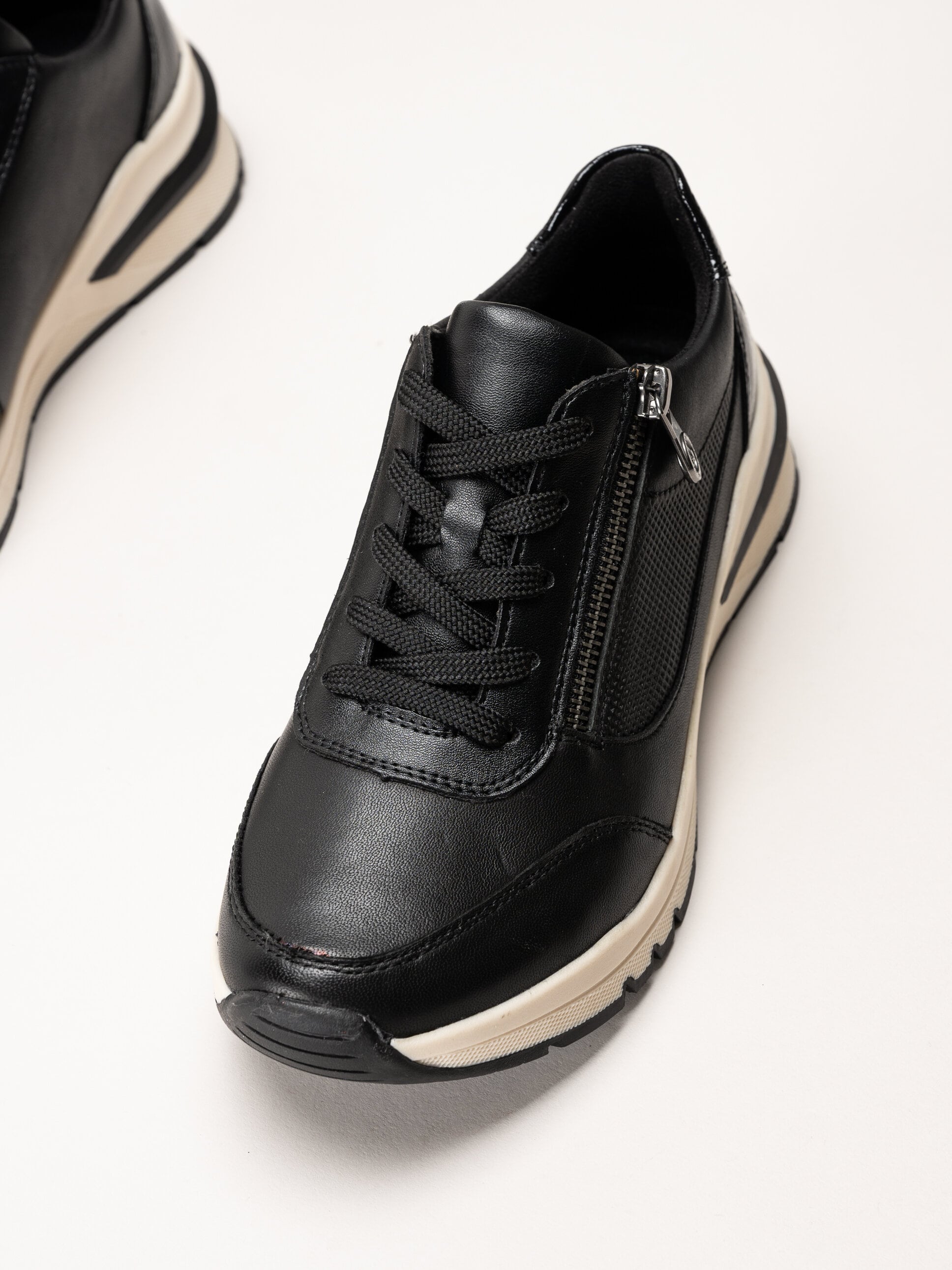 Rieker - Svarta promenadsneakers i skinn