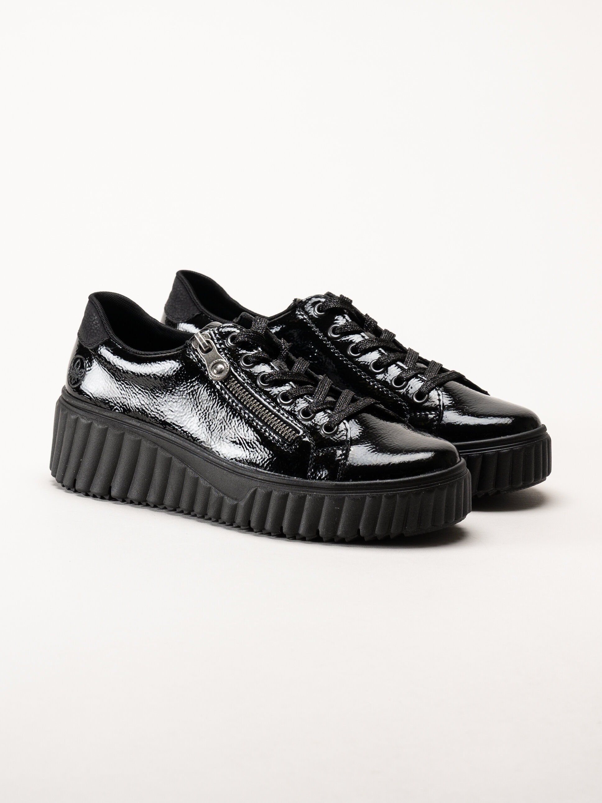 Rieker - Svarta platåsneakers i skinn-lack