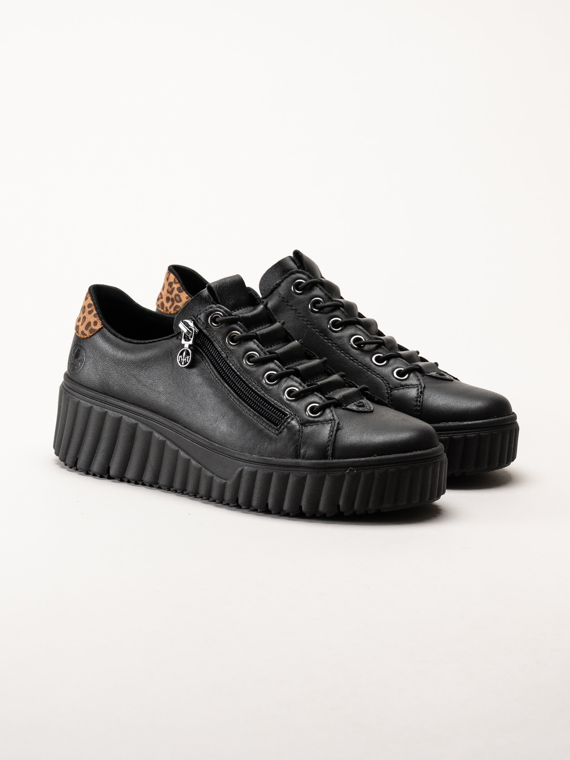 Rieker - Svarta sneakers i skinn