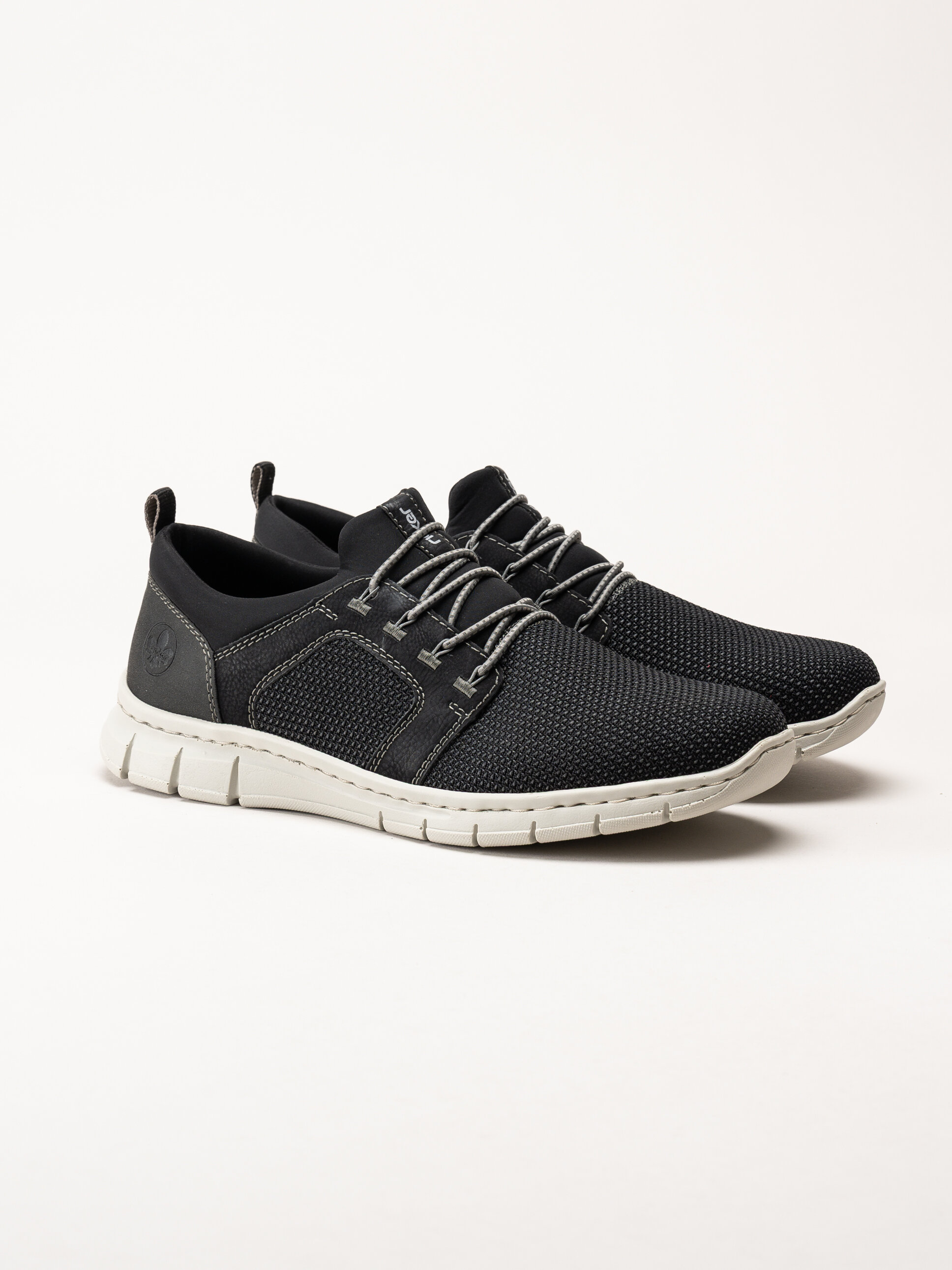 Rieker - Svarta sportiga slip on skor