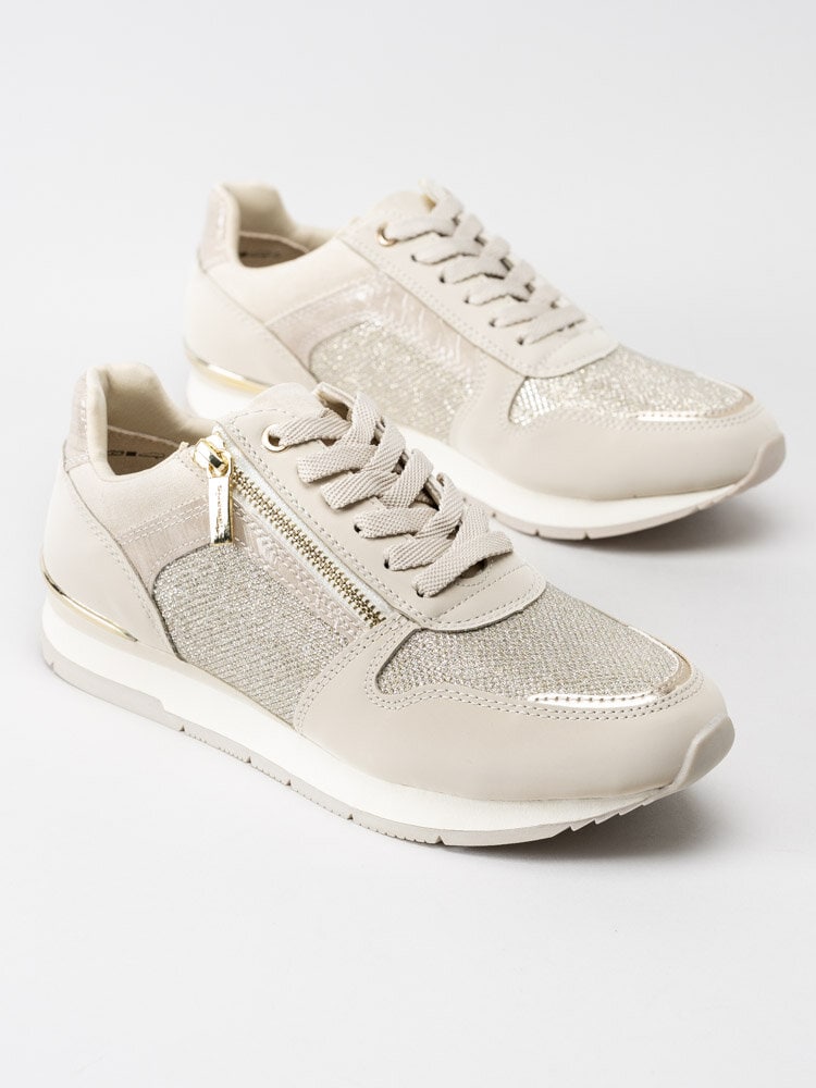 Tamaris - Beige sportskor med guldiga detaljer
