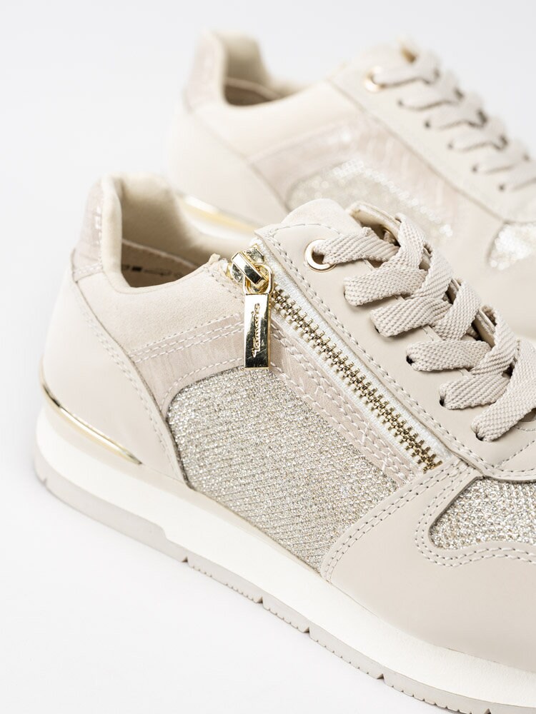 Tamaris - Beige sportskor med guldiga detaljer