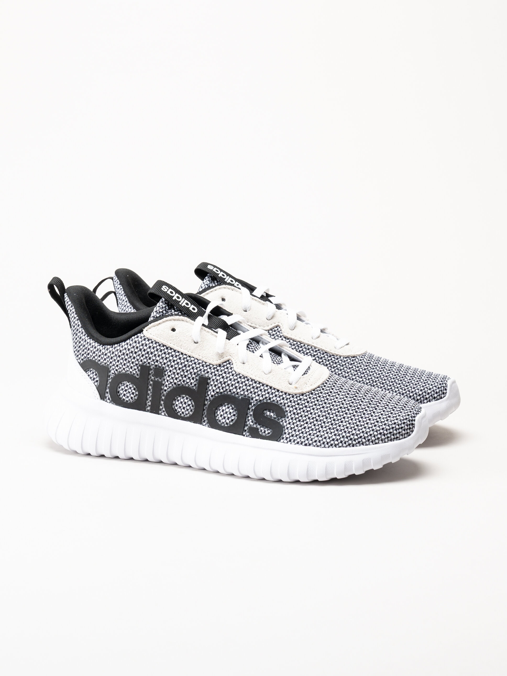 Adidas - Kaptir Base - Svartvita sneakers i textil